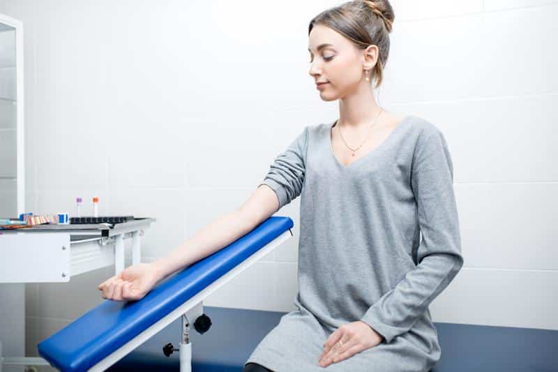Woman-doctors-office-lab-blood-test On-site lab