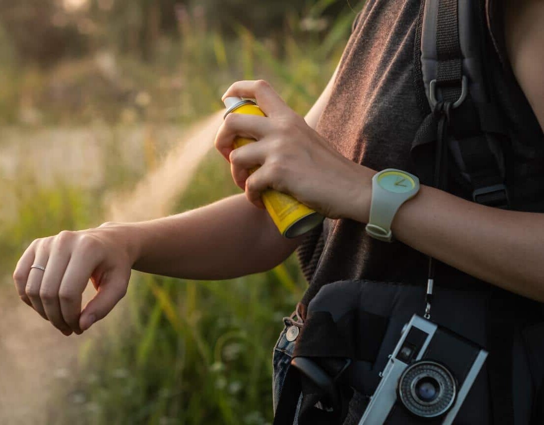 Woman-using-bug-spray-malaria-protection Travel health