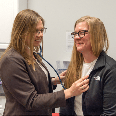 Amanda caldwell, pa-c conducts a patient exam with a stethoscope at star city medical, illustrating the role of internists in complex healthcare cases through attentive, coordinated internal medicine care.